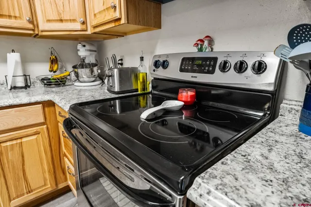 a kitchen with a stove and a sink