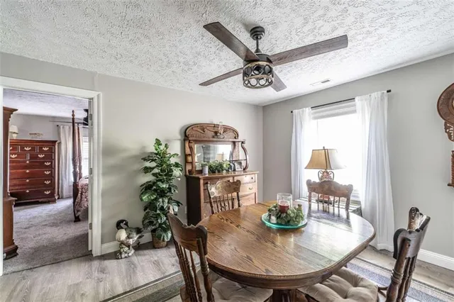 a view of a dining room with furniture