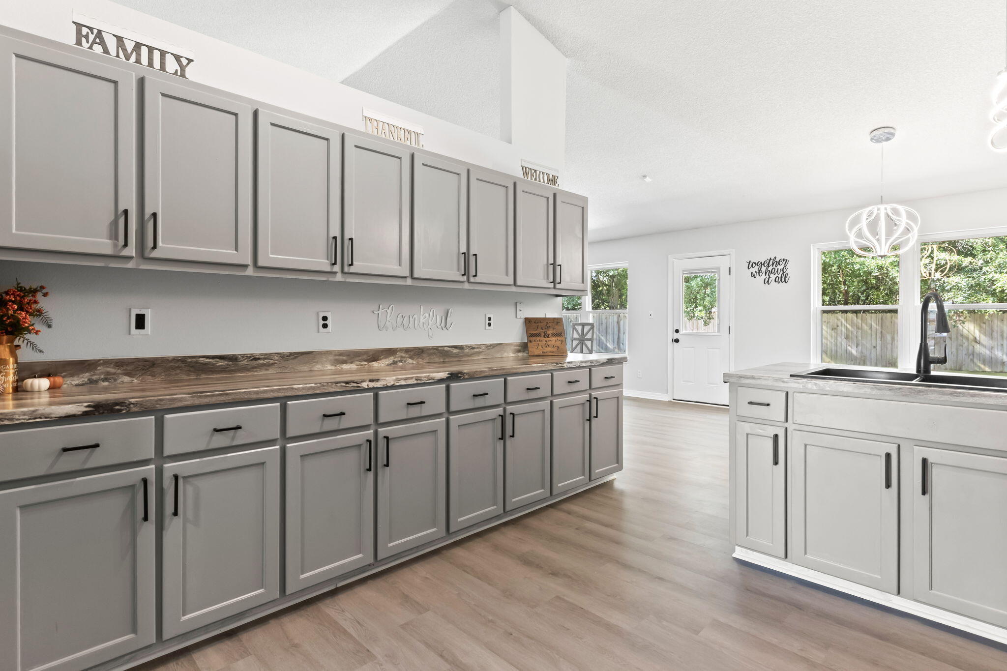 3650 Berrypatch Lane Pace, FL 32571 - Photo 12 of 53 a kitchen with granite countertop white cabinets and white appliances