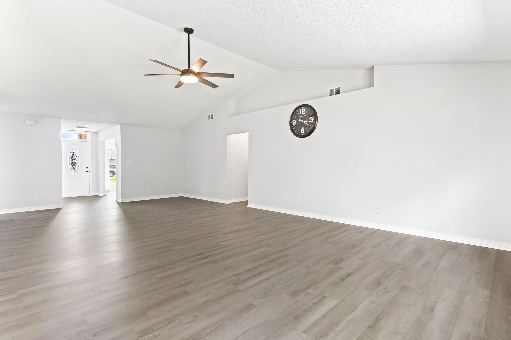 3650 Berrypatch Lane Pace, FL 32571 - Photo 14 of 53 an empty room with wooden floor ceiling fan and window