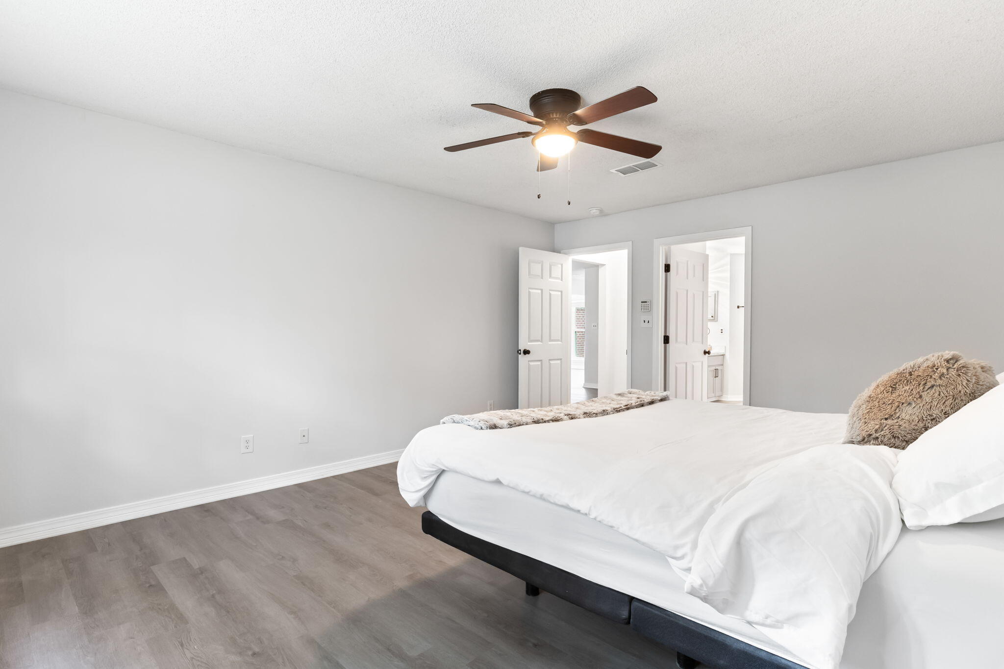 3650 Berrypatch Lane Pace, FL 32571 - Photo 22 of 53 a bedroom with a bed and a chandelier