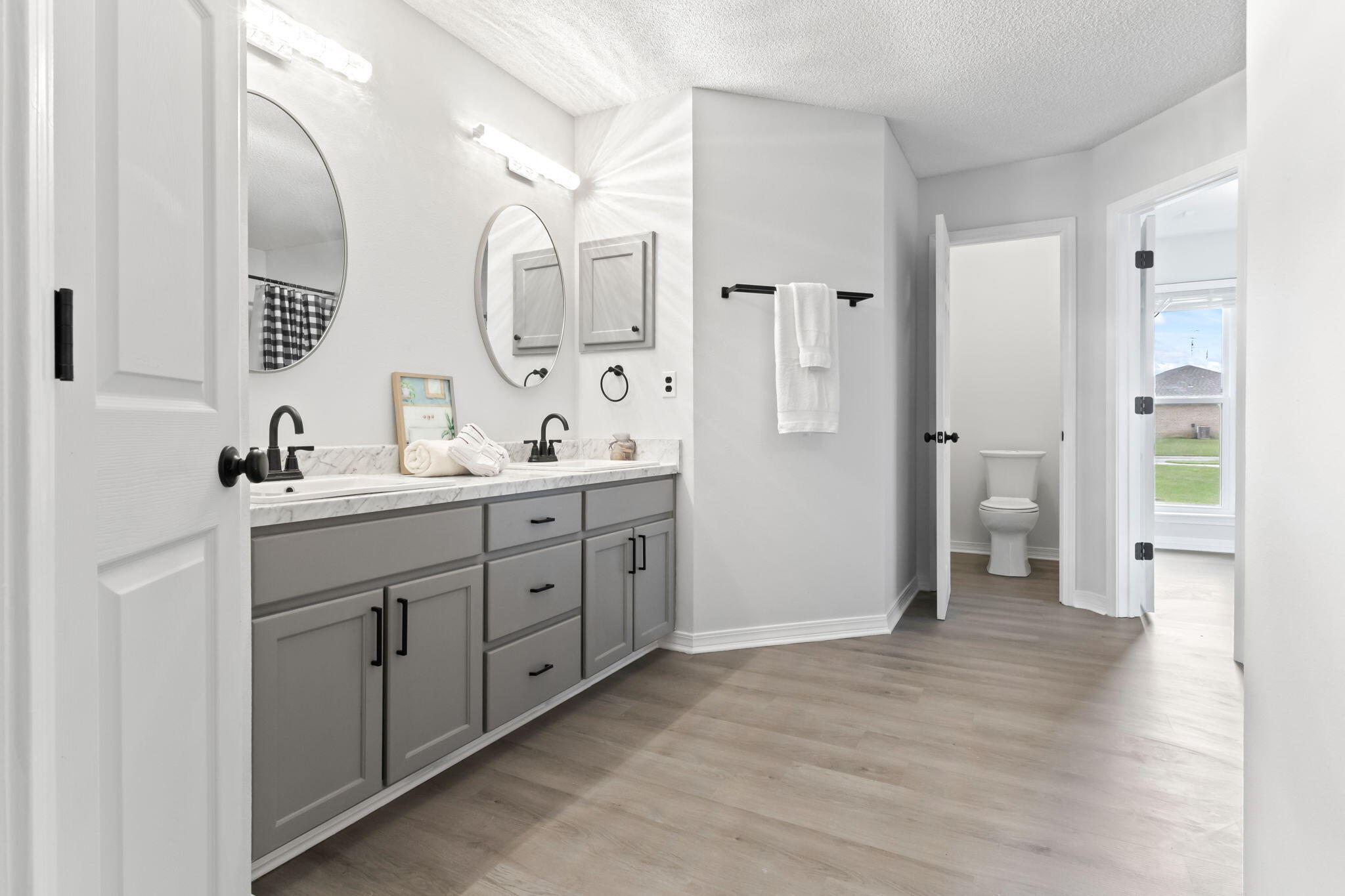 3650 Berrypatch Lane Pace, FL 32571 - Photo 24 of 53 a spacious bathroom with a double vanity sink a toilet and a mirror