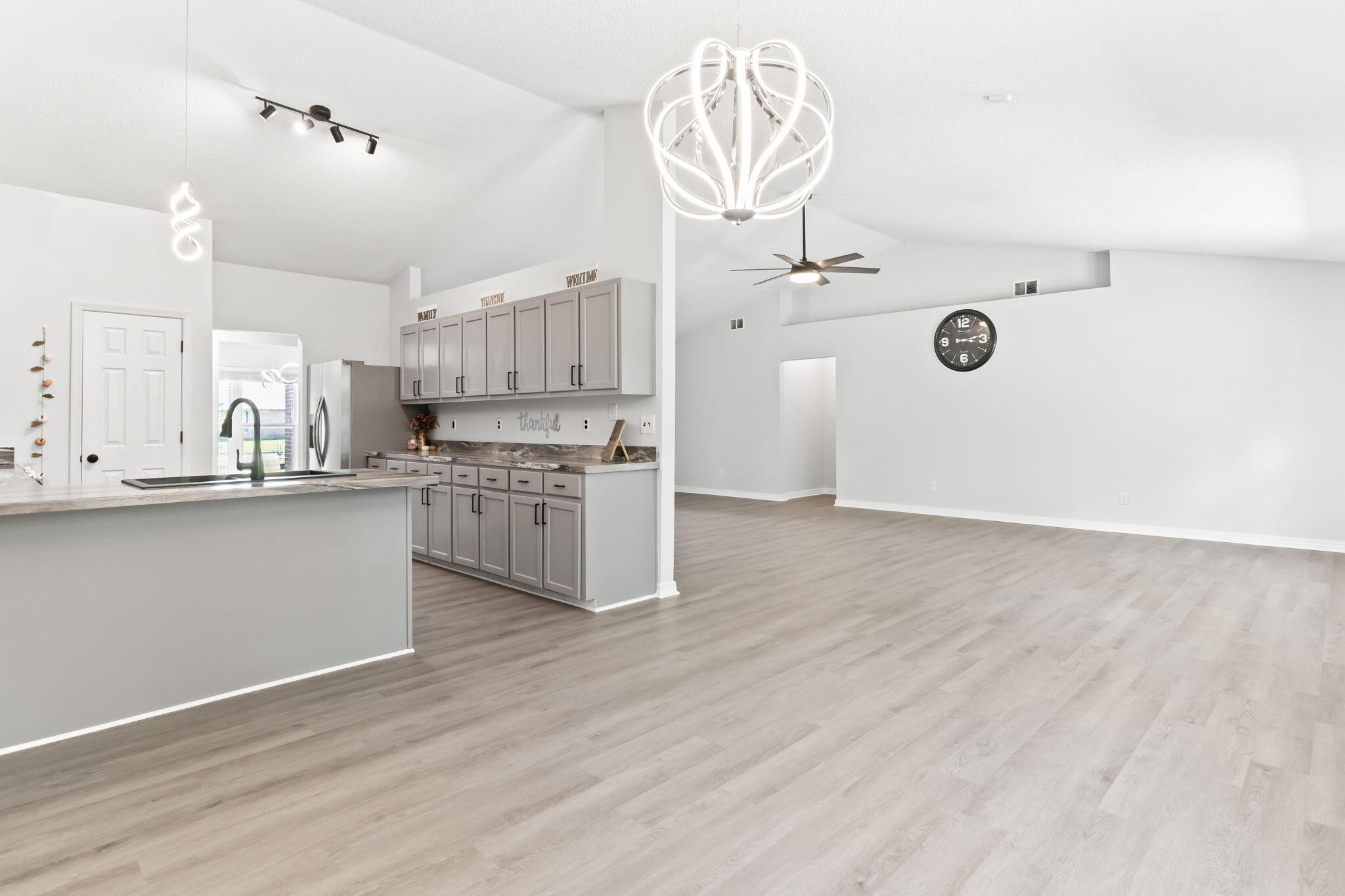 3650 Berrypatch Lane Pace, FL 32571 - Photo 3 of 53 a kitchen with a refrigerator a sink and cabinets