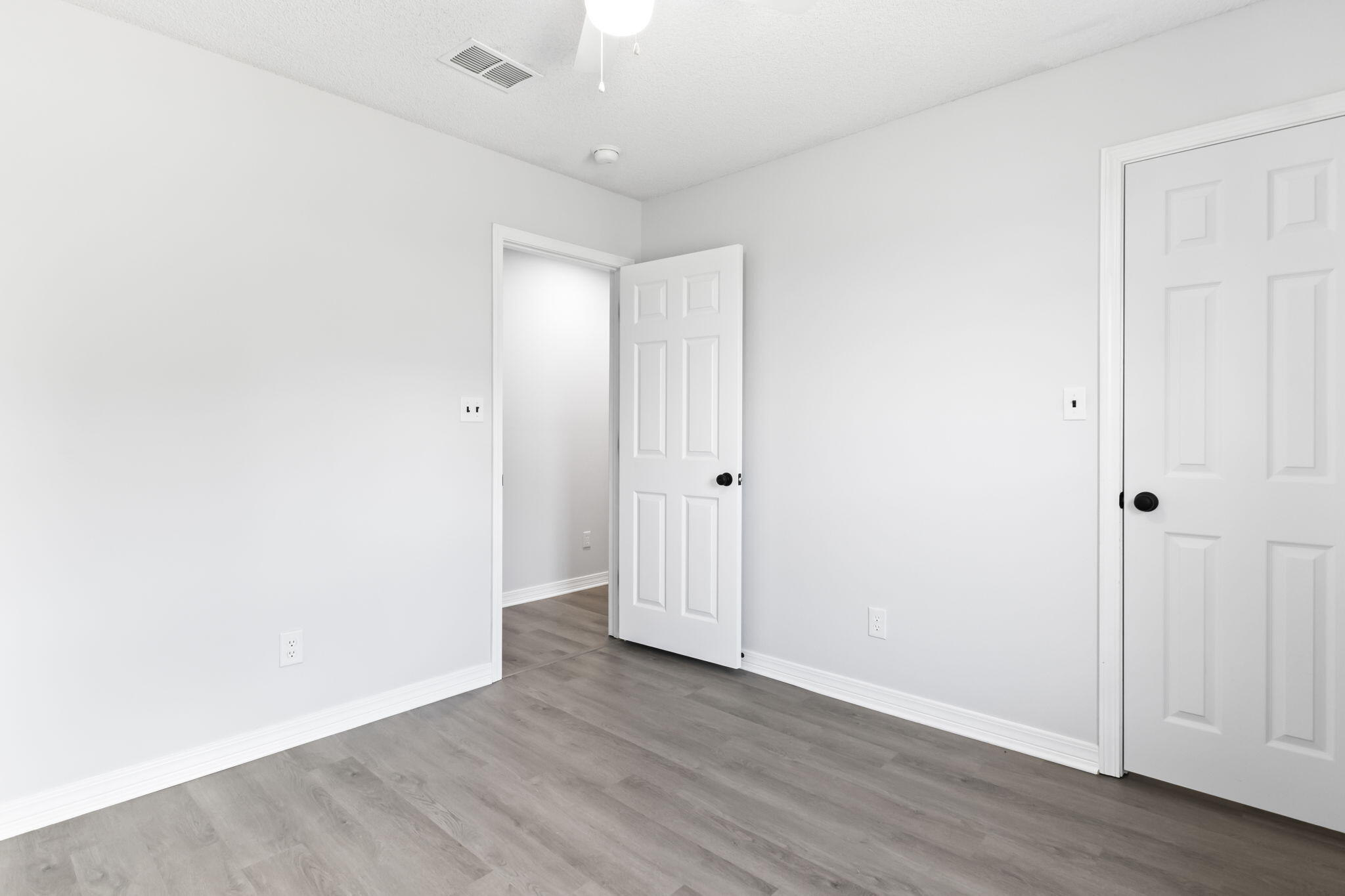 3650 Berrypatch Lane Pace, FL 32571 - Photo 37 of 53 an empty room with wooden floor