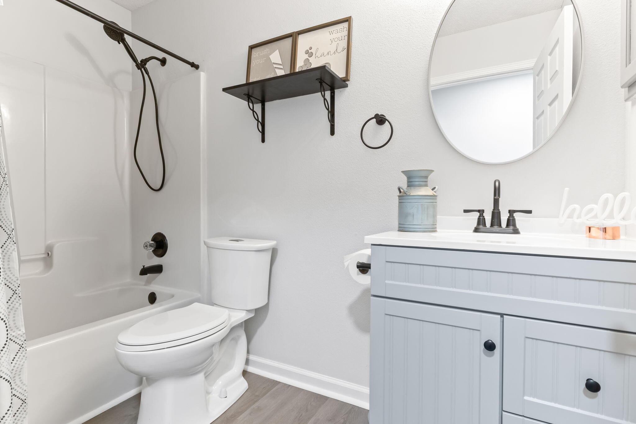 3650 Berrypatch Lane Pace, FL 32571 - Photo 38 of 53 a bathroom with a toilet sink vanity and mirror