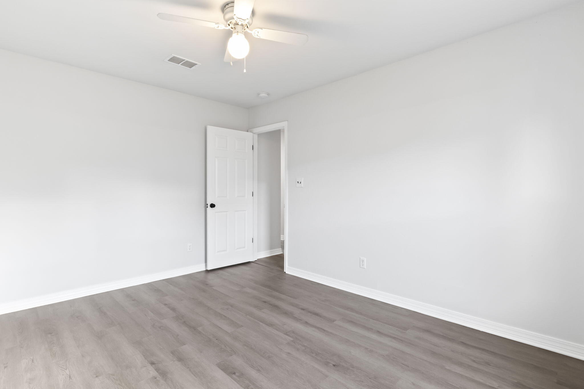 3650 Berrypatch Lane Pace, FL 32571 - Photo 41 of 53 an empty room with wooden floor and fan