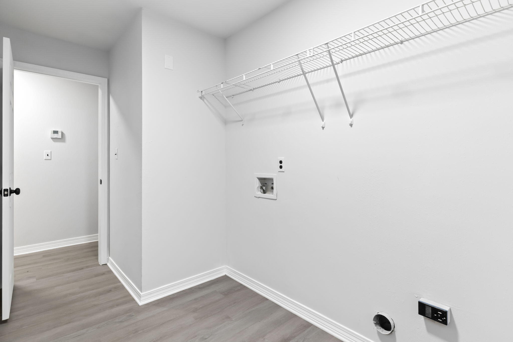 3650 Berrypatch Lane Pace, FL 32571 - Photo 44 of 53 a view of a room with racks on the wall