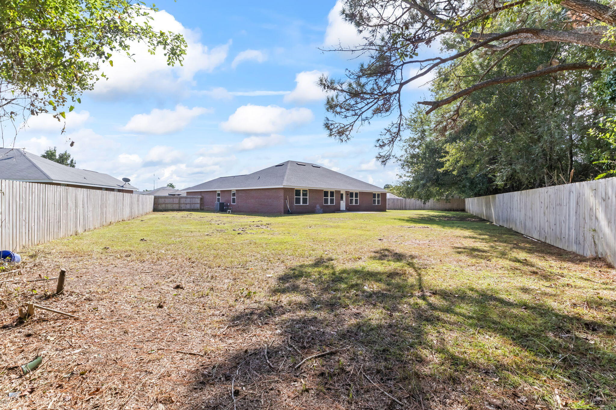 3650 Berrypatch Lane Pace, FL 32571 - Photo 47 of 53 a view of yard with swimming pool and wooden fence