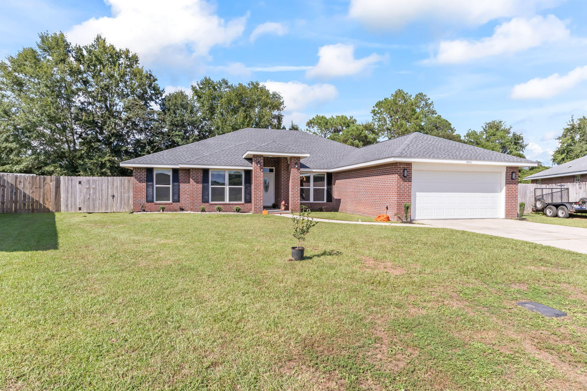 3650 Berrypatch Lane Pace, FL 32571 - Photo 48 of 53 a front view of a house with a garden