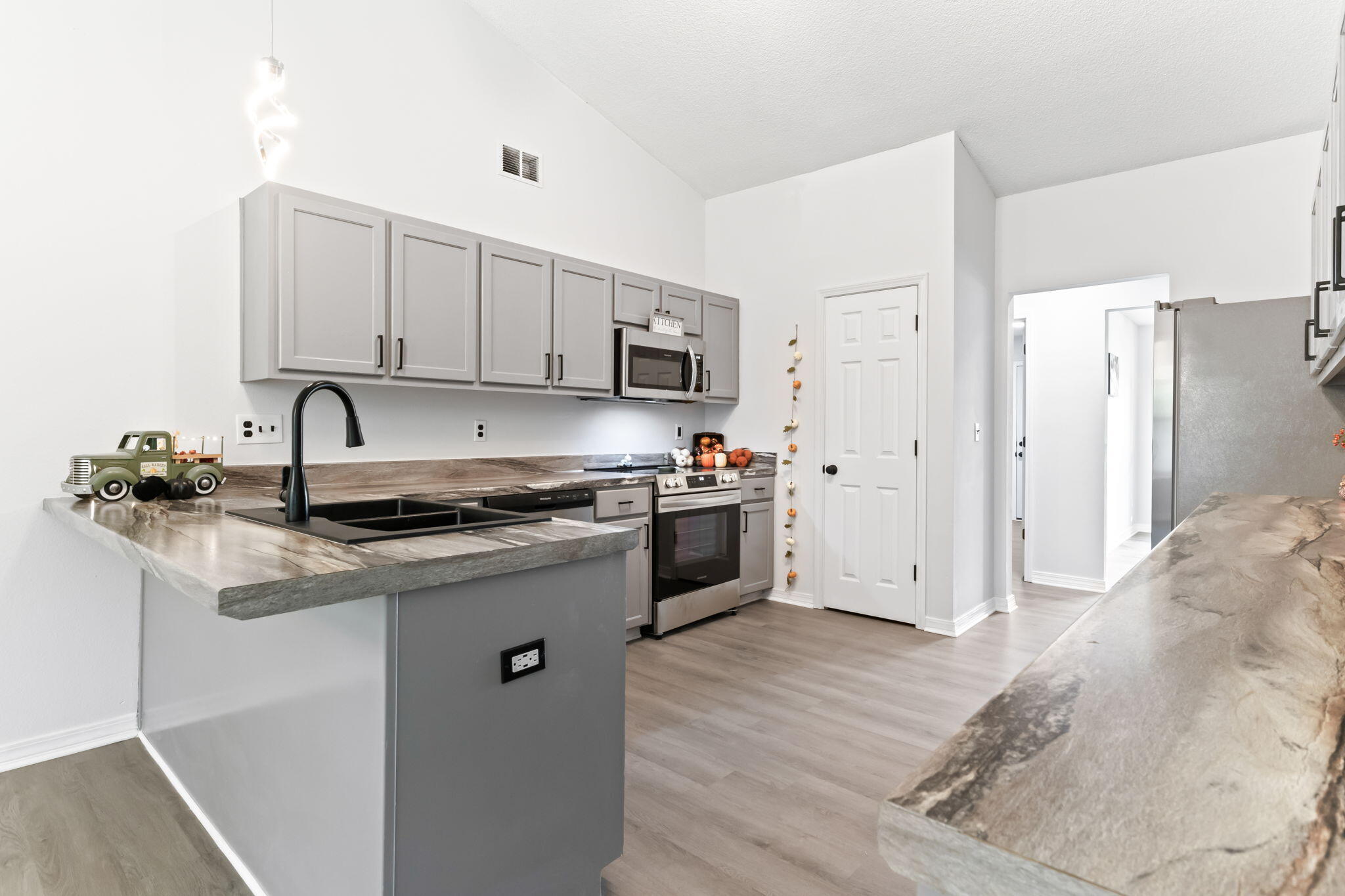 3650 Berrypatch Lane Pace, FL 32571 - Photo 5 of 53 a kitchen with stainless steel appliances granite countertop a sink stove and refrigerator