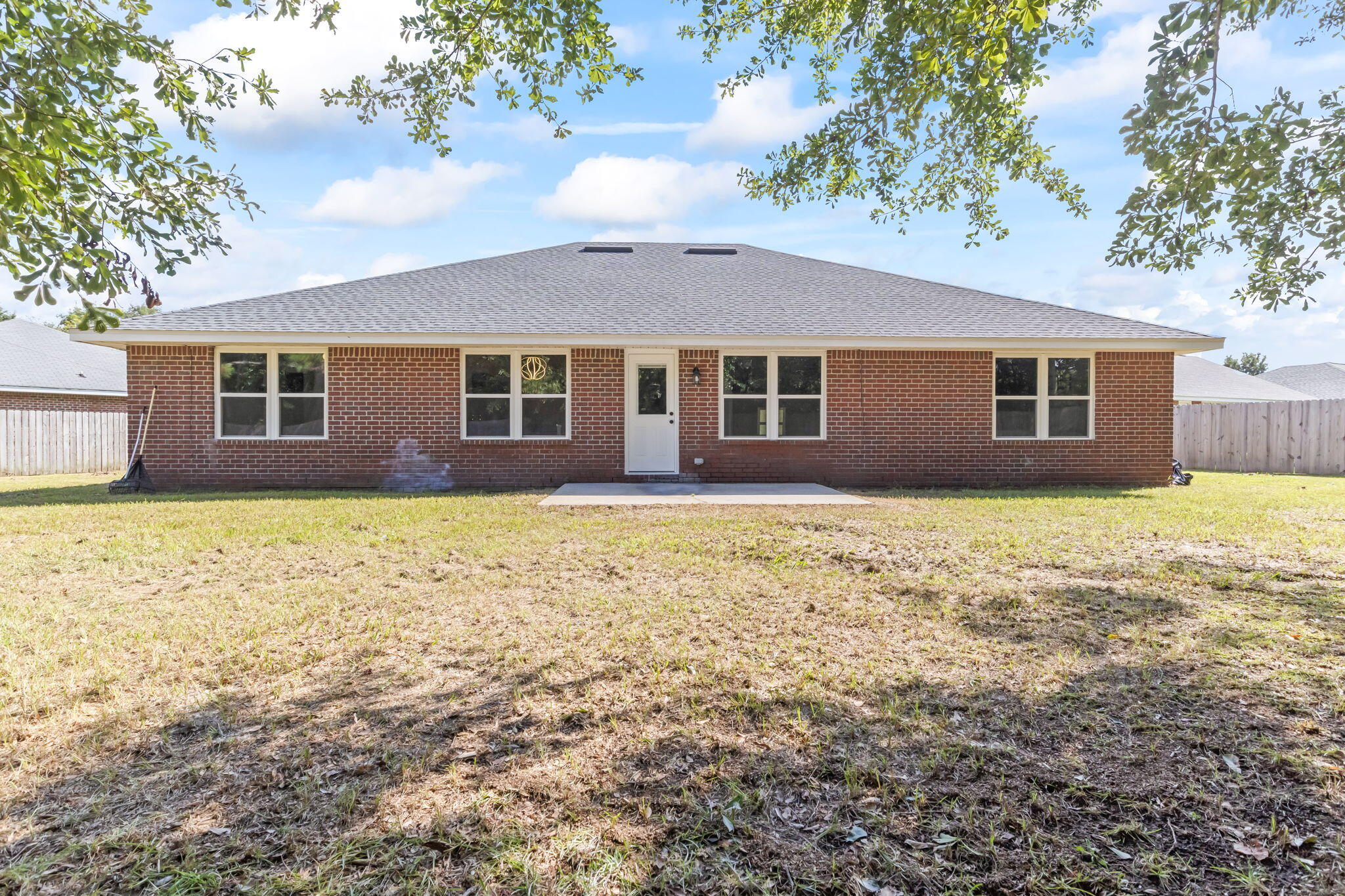3650 Berrypatch Lane Pace, FL 32571 - Photo 51 of 53 a front view of house with yard and trees around