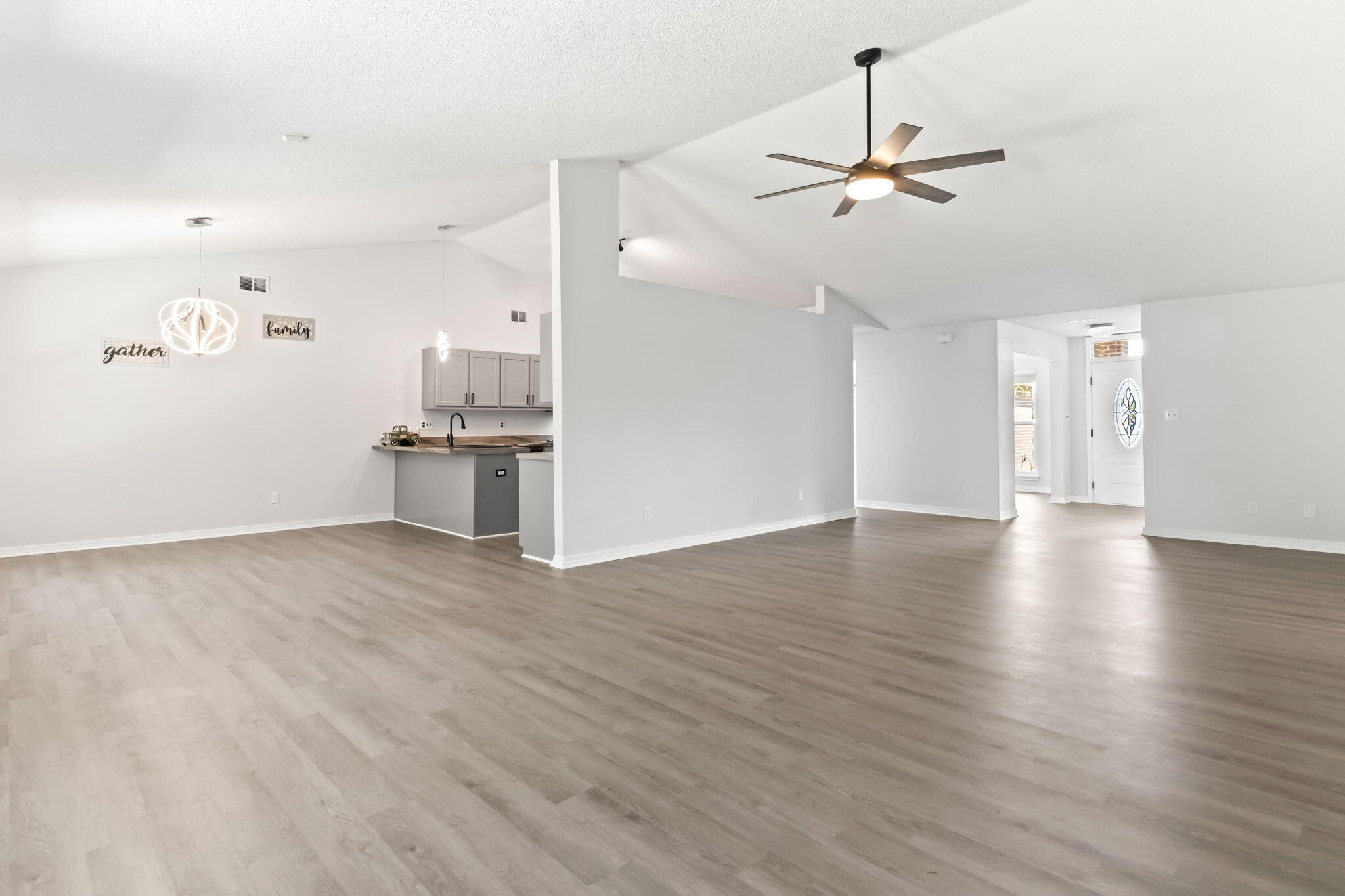 3650 Berrypatch Lane Pace, FL 32571 - Photo 6 of 53 a view of a kitchen with a sink and stainless steel appliances