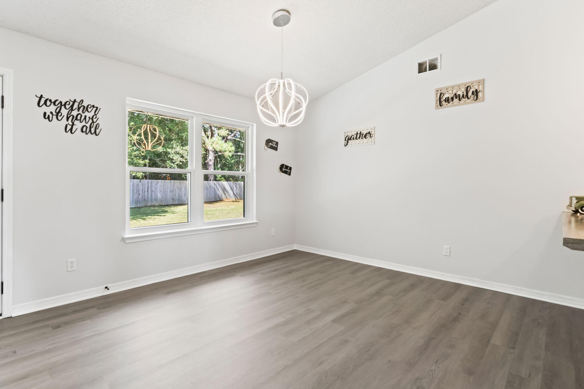 3650 Berrypatch Lane Pace, FL 32571 - Photo 8 of 53 an empty room with windows and ceiling fan