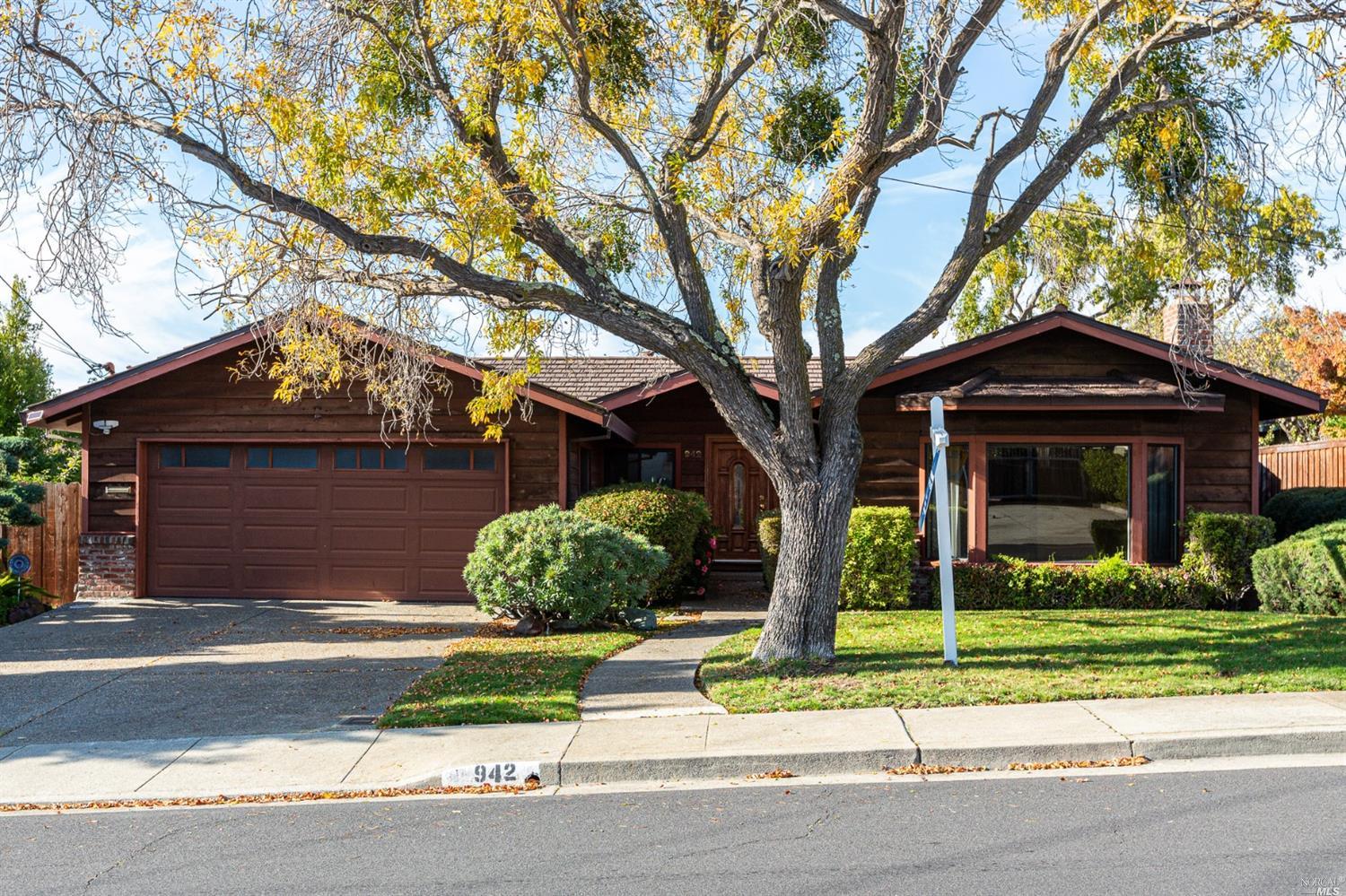 a front view of a house with garage