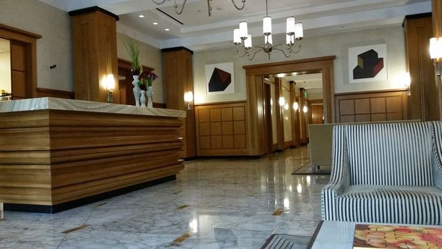 a view of a hallway with a chandelier