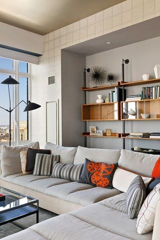 a living room with furniture and walk in closet