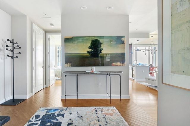 a living room with a couch and a wooden floor
