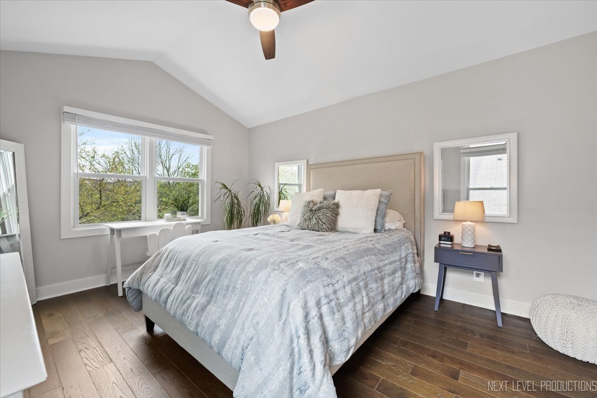 1257 Rhodes Lane Naperville, IL 60540 - Photo 13 of 24 a bedroom with a bed lamps and window