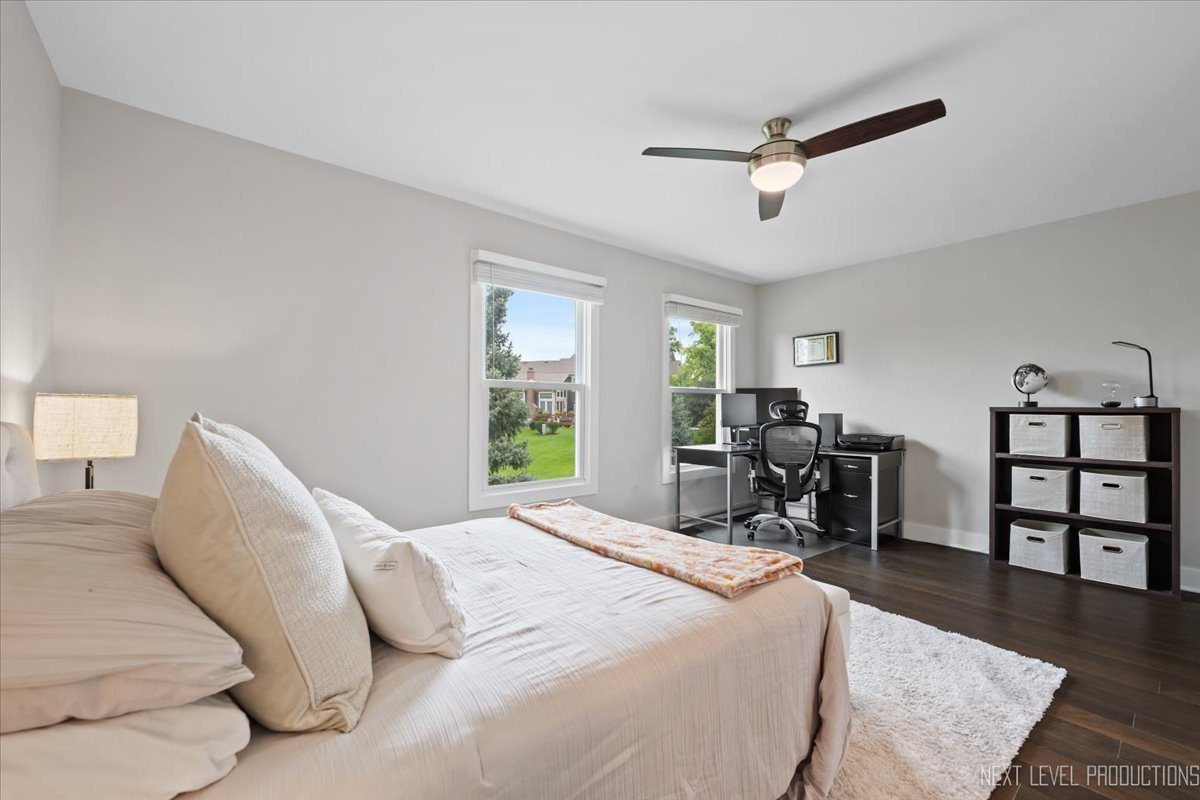 1257 Rhodes Lane Naperville, IL 60540 - Photo 20 of 24 a bedroom with a bed furniture and a window