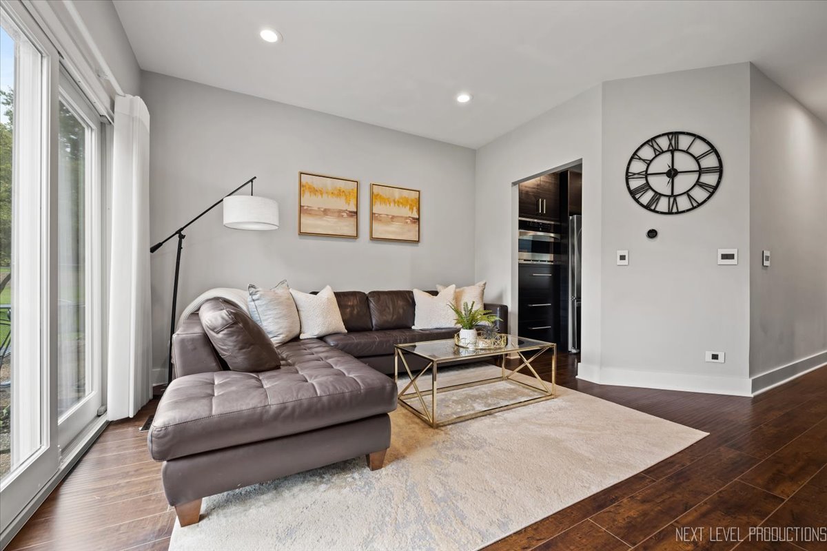 1257 Rhodes Lane Naperville, IL 60540 - Photo 9 of 24 a living room with furniture and wooden floor