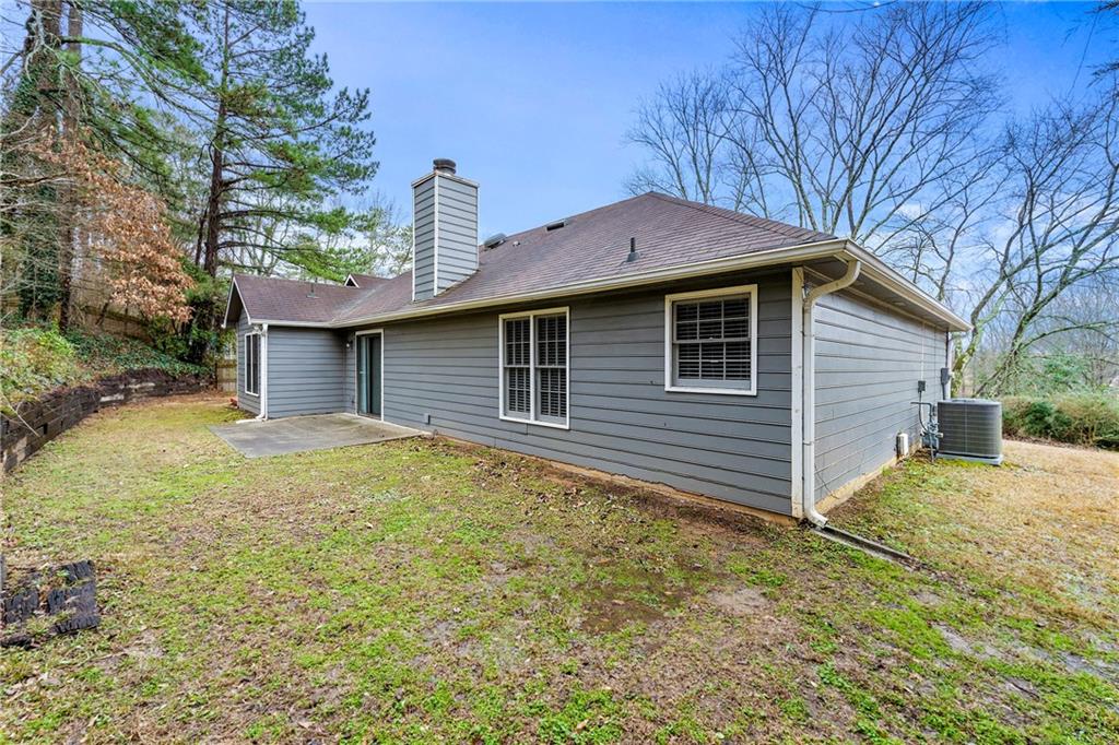 2065 Arbor Forest Drive Southwest Marietta, GA 30064 - Photo 14 of 15 a view of a house with a yard