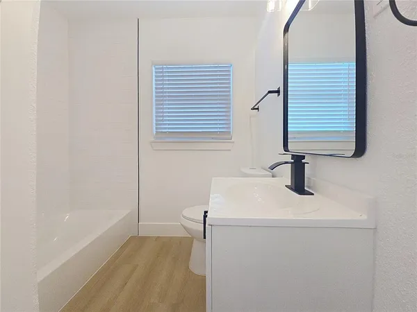 a bathroom with a sink and a bathtub