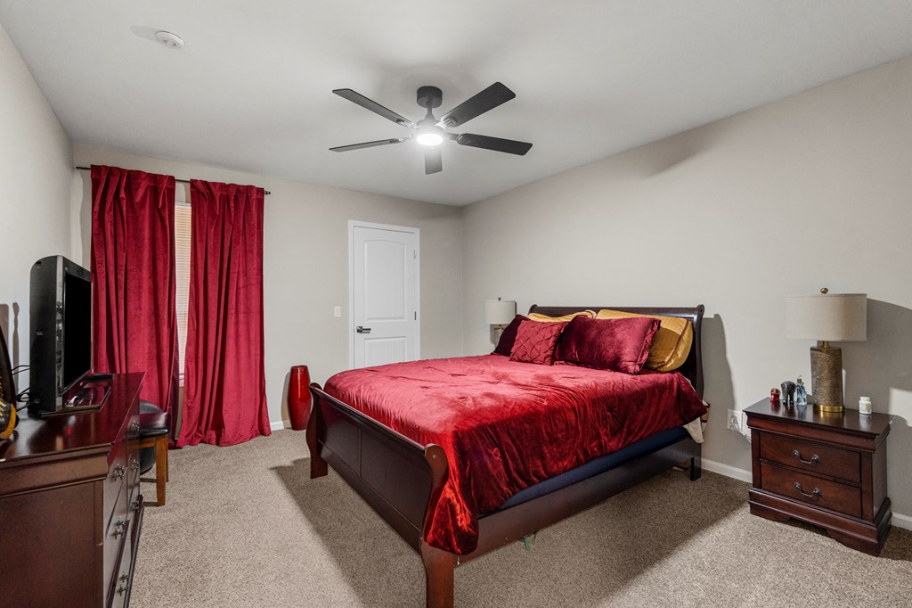 2525 Norris Road, Unit 38 Columbus, GA 31907 - Photo 16 of 27 a spacious bedroom with a bed and a chandelier