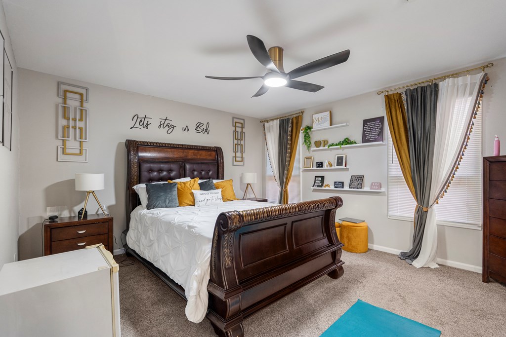 2525 Norris Road, Unit 38 Columbus, GA 31907 - Photo 19 of 27 a bedroom with a large bed and a chandelier