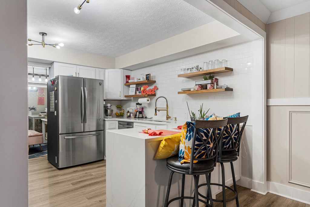 2525 Norris Road, Unit 38 Columbus, GA 31907 - Photo 10 of 27 a kitchen with stainless steel appliances a refrigerator and a wooden floor