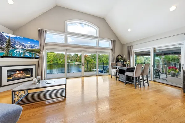 a living room with furniture and a floor to ceiling window
