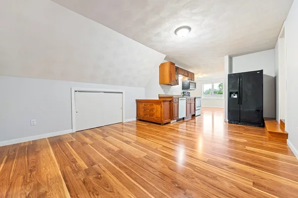 a view of a livingroom with wooden floor