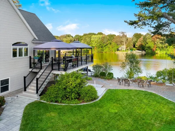 a view of a house with a yard porch and sitting area