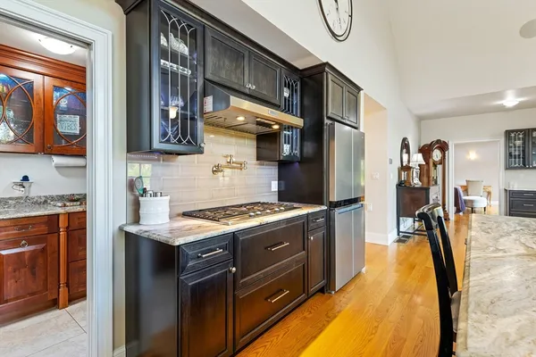 a kitchen with stainless steel appliances granite countertop a stove and a sink