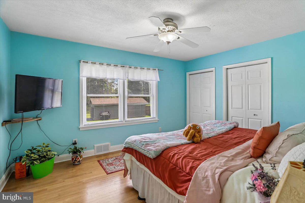 321 North 3rd Street Oakland, MD 21550 - Photo 24 of 48 a bedroom with a bed and a flat screen tv