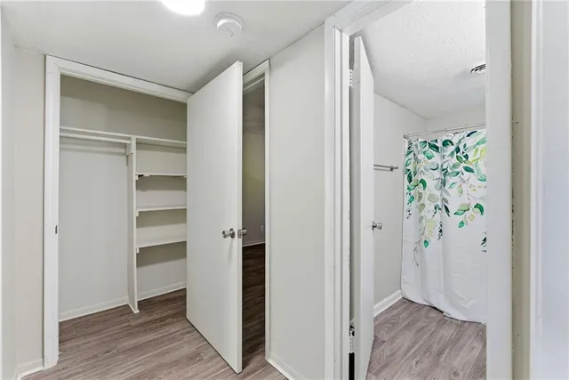 a view of an entryway with wooden floor and closet