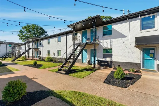 a view of a backyard with swimming pool
