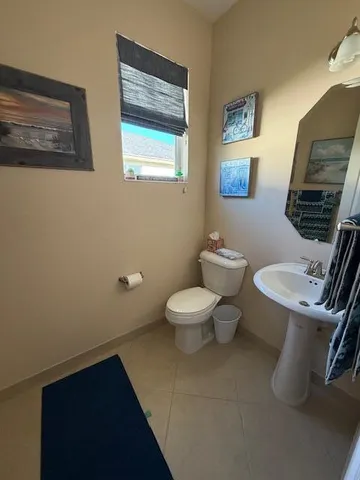a en suite bathroom with a sink a mirror and a shower