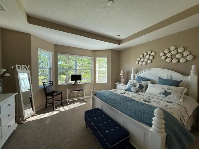 a view of a lake with houses in the back