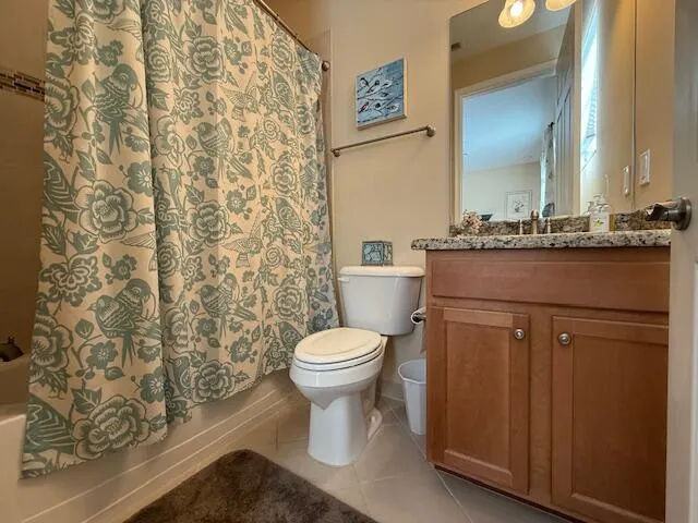 a view of a house with a palm tree