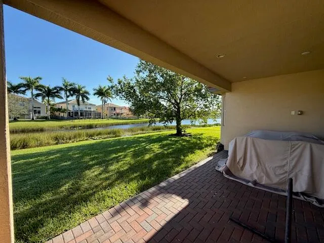 an aerial view of residential house with outdoor space and pool