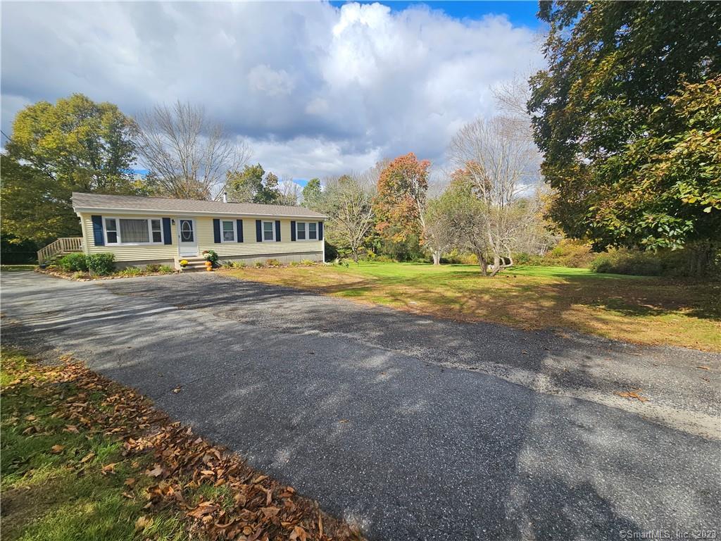 41 Cornell Road Plainfield, CT 06374 - Photo 1 of 1 a front view of house with yard and green space