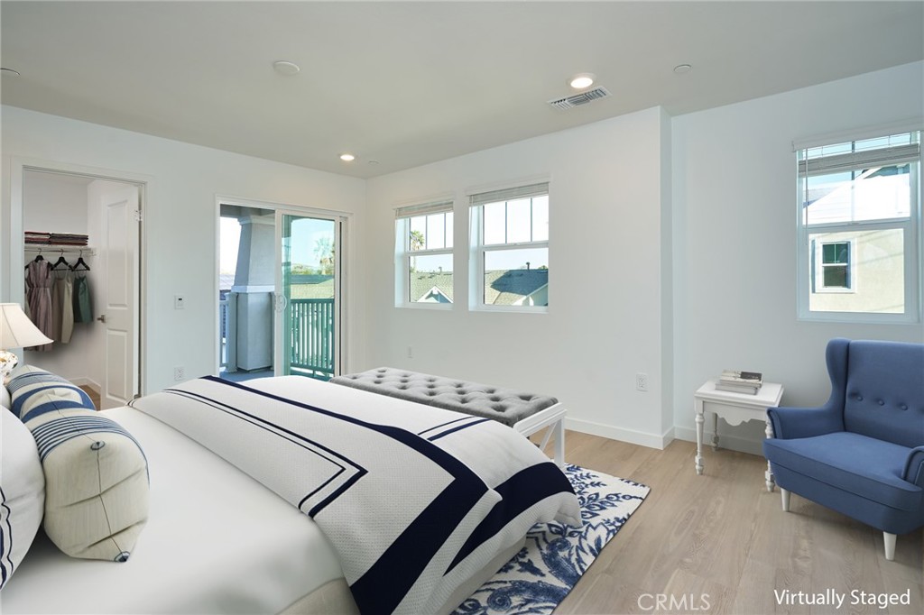 2448 Haley Pt Drive, Unit 105 Ventura, CA 93003 - Photo 12 of 27 a bedroom with double bed and a couch