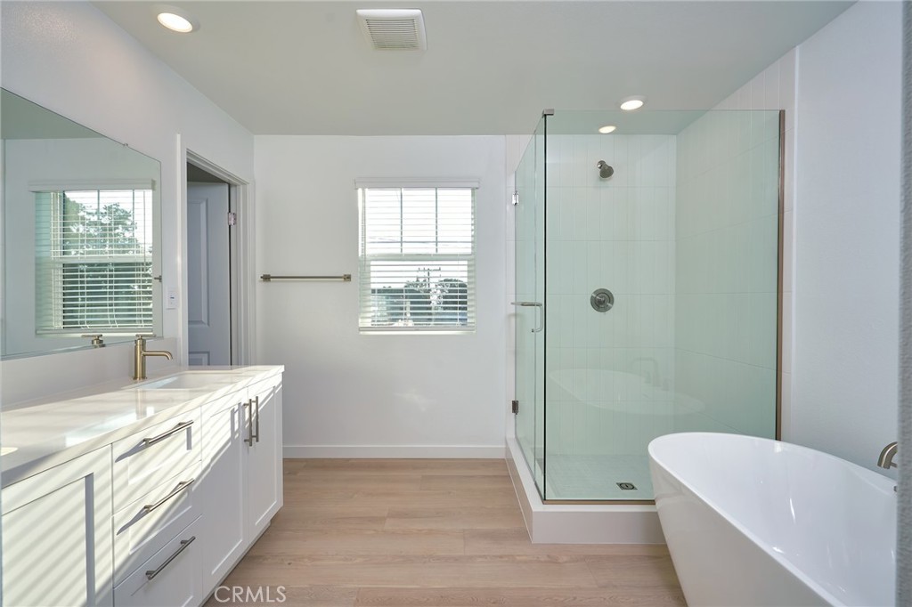 2448 Haley Pt Drive, Unit 105 Ventura, CA 93003 - Photo 15 of 27 a spacious bathroom with a tub sink and mirror