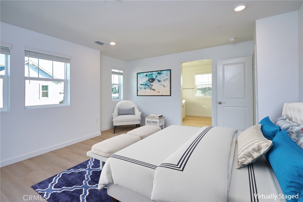 2448 Haley Pt Drive, Unit 105 Ventura, CA 93003 - Photo 17 of 27 a bedroom with two beds and a table