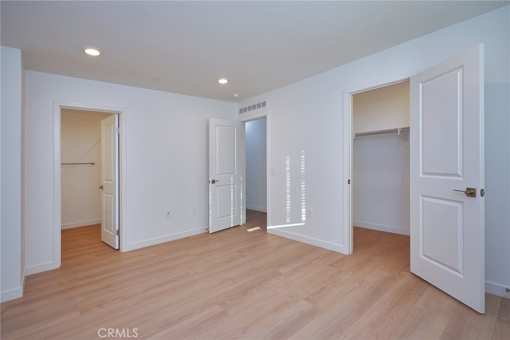 2448 Haley Pt Drive, Unit 105 Ventura, CA 93003 - Photo 18 of 27 a view of empty room with wooden floor