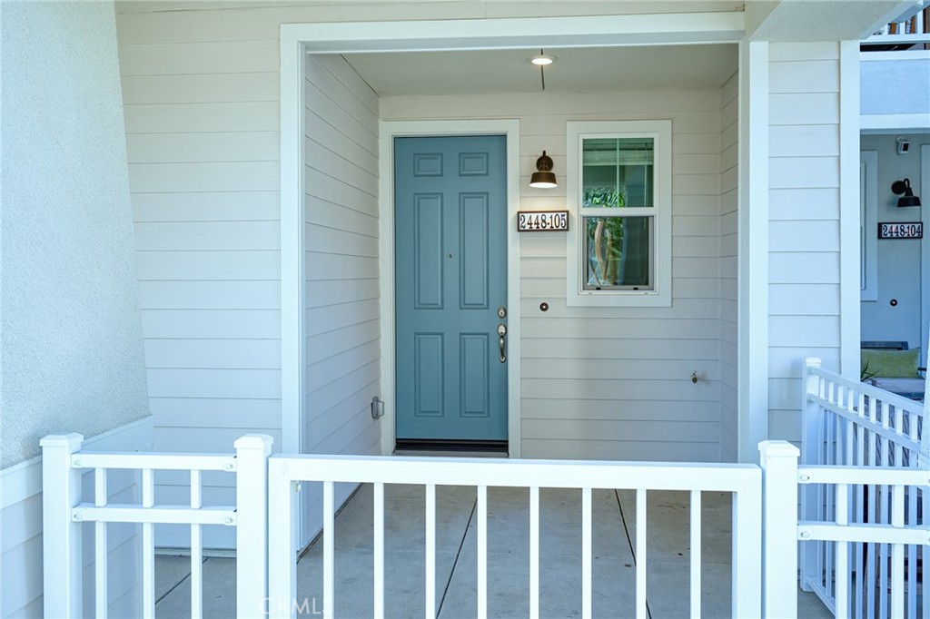 2448 Haley Pt Drive, Unit 105 Ventura, CA 93003 - Photo 2 of 27 a view of a wooden door