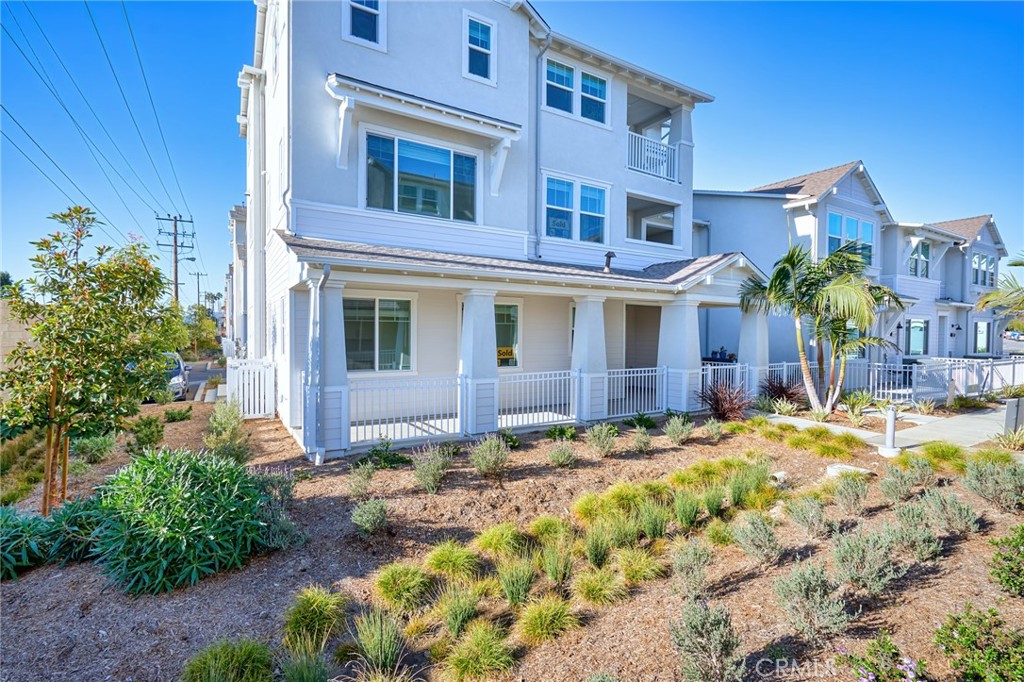 2448 Haley Pt Drive, Unit 105 Ventura, CA 93003 - Photo 24 of 27 a view of a house with a yard