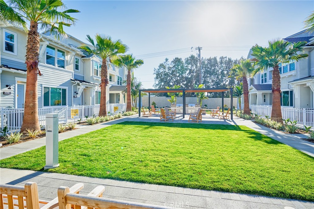 2448 Haley Pt Drive, Unit 105 Ventura, CA 93003 - Photo 25 of 27 a swimming pool with outdoor seating and yard