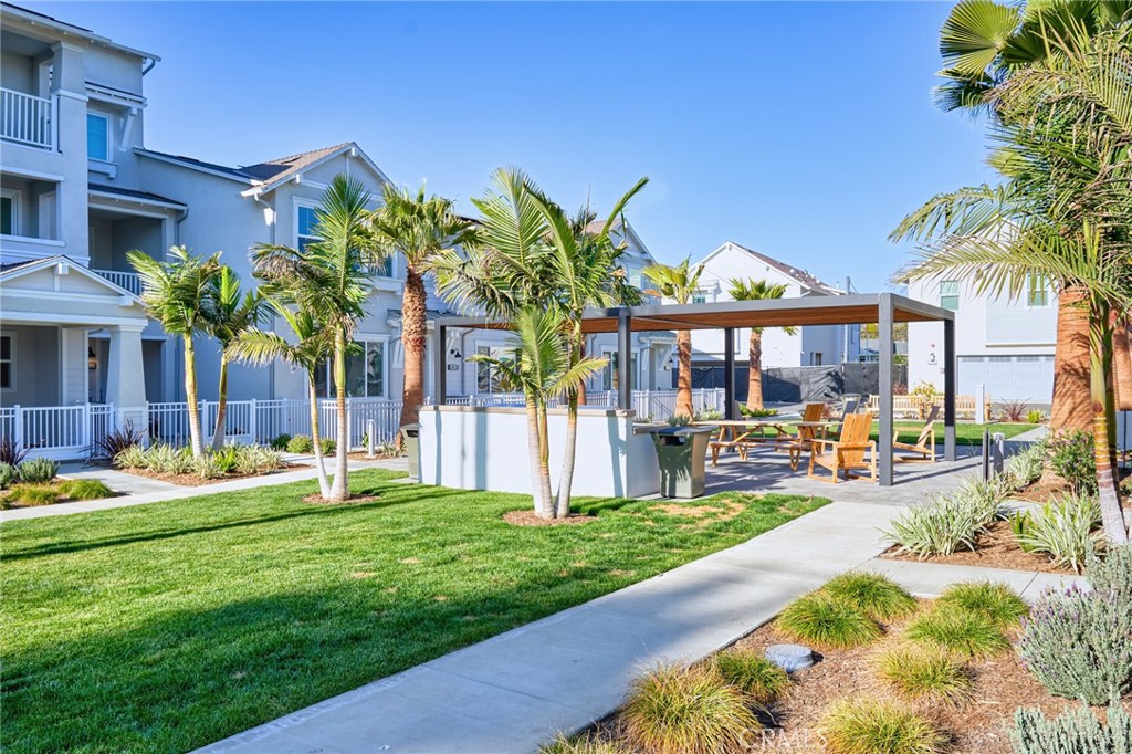 2448 Haley Pt Drive, Unit 105 Ventura, CA 93003 - Photo 26 of 27 a front view of a house with swimming pool garden and patio