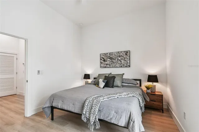 a bathroom with a double vanity sink a mirror and a shower